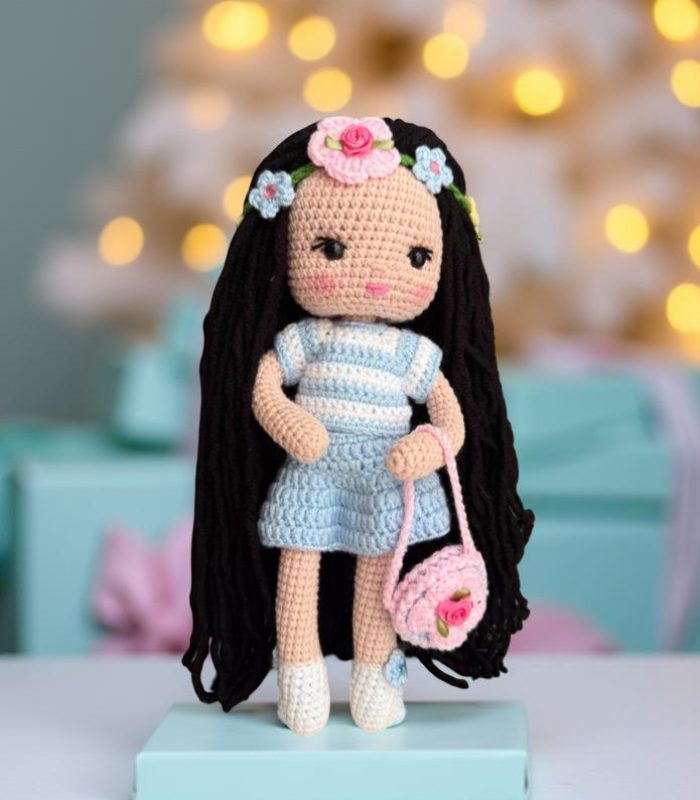 Myrtilus Nawara – A Handmade Crochet Doll by Myrtilus with Long Black Hair, Blue Striped Dress, and Floral Crown